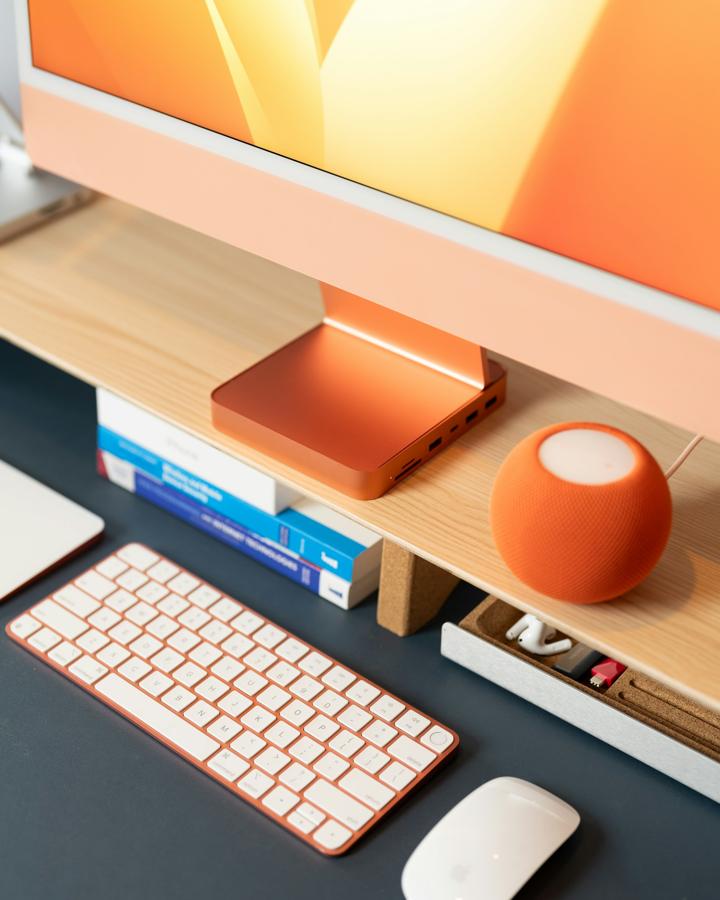 a computer keyboard, mouse, and monitor on a desk