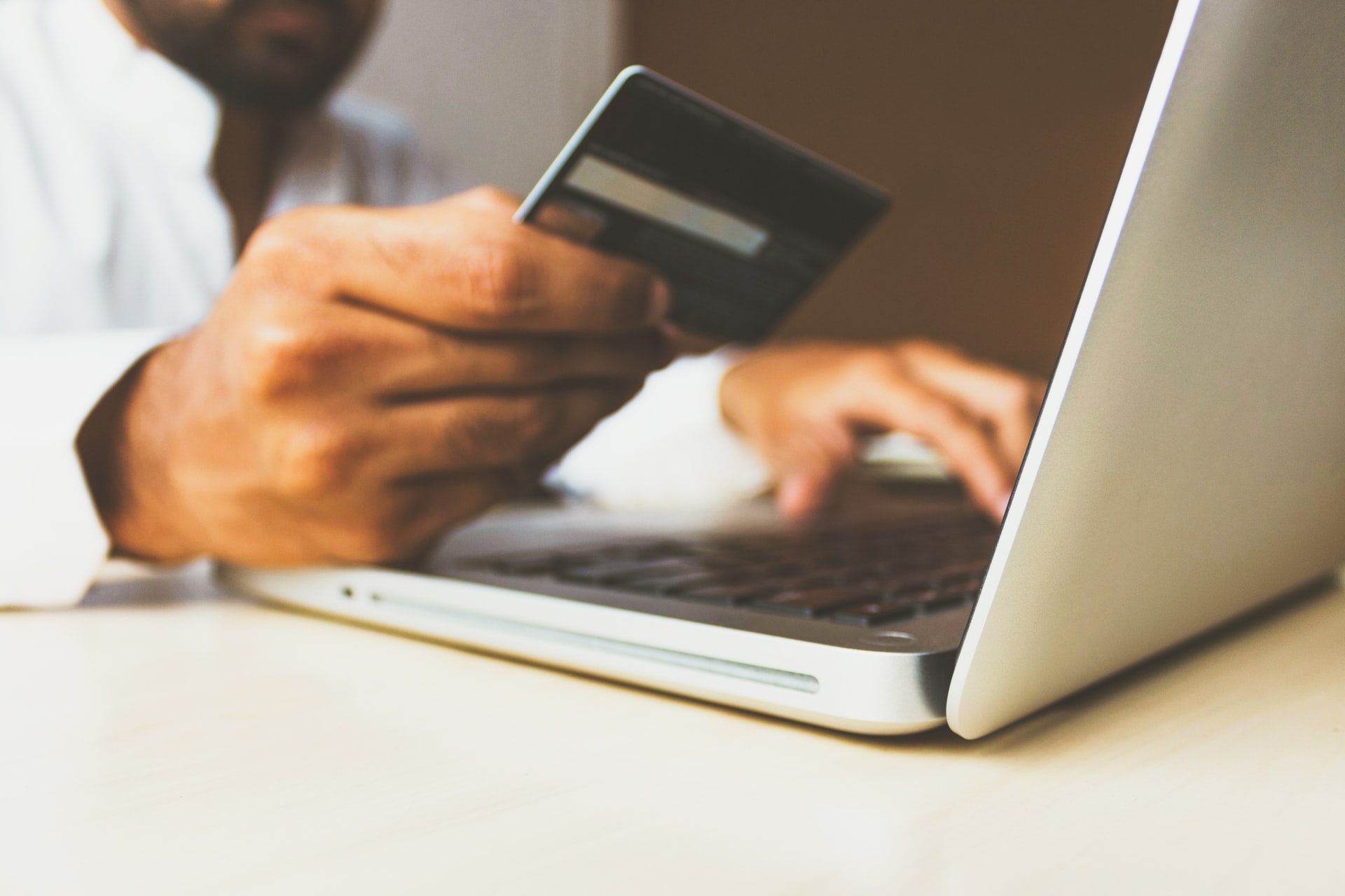 man using laptop to make a payment