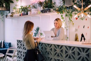 woman making a purchase in a boutique