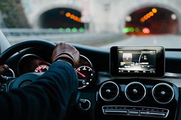 dashboard of car; driving toward tunnel