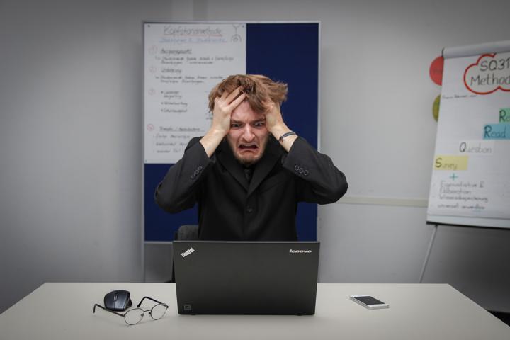 person using black laptop computer