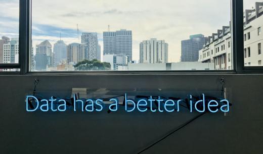 white building with data has a better idea text signage