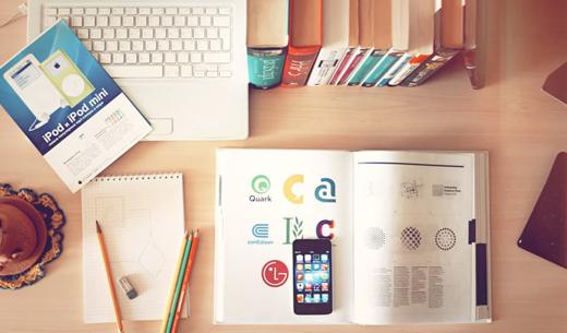 pencils and smartphone on top of books