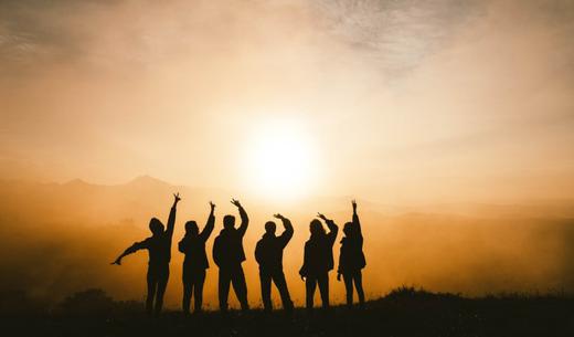 silhouette photo of six persons on top of mountain