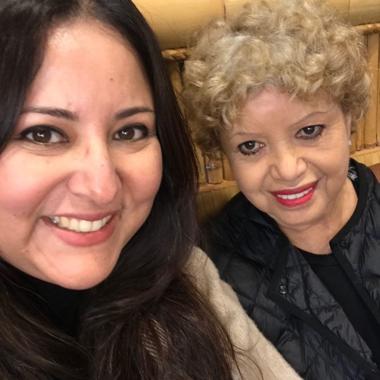 Caregiver taking a smiling selfie with her mom