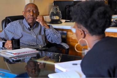 Caregiver sitting at the table with her father