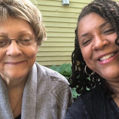 Caregiver taking a smiling selfie with her mother