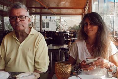 Caregiver sitting at lunch with her father