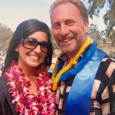 Caregiver smiling outside with her father