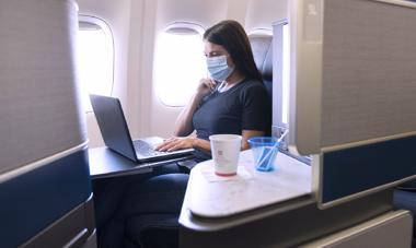 Woman wearing mask, working in United Polaris